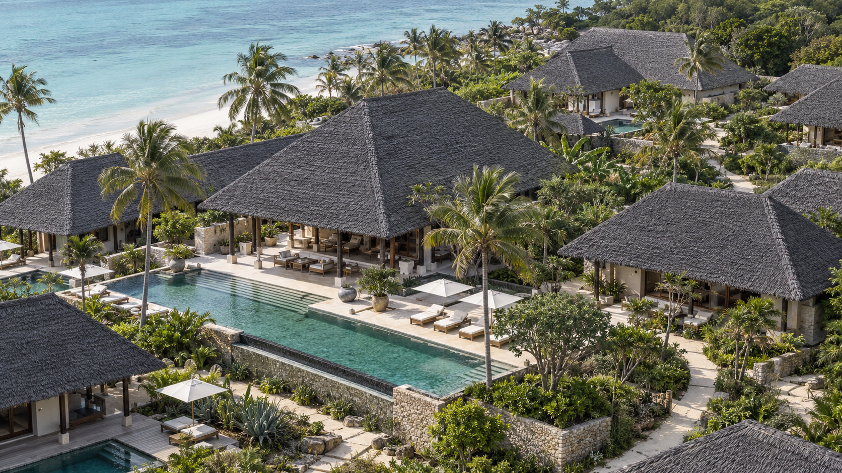 Finished NextPalm Thatch roofs across a completed project, from the air